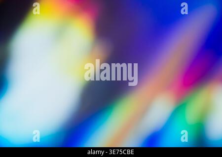 Diagonal colorful holographic light leak abstract blurred background Stock Photo