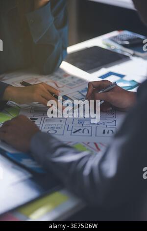 Team of Program Developer Collaborating on UXUI Design Planning in a Modern Office Environment Stock Photo