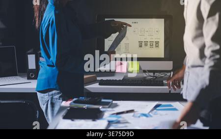 Team of Program Developer Collaborating on UXUI Design Planning in a Modern Office Environment Stock Photo