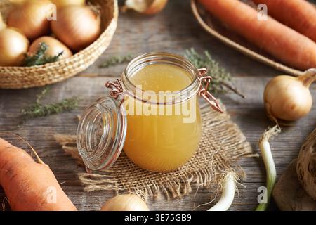 Bone broth or chicken soup in a glass jar Stock Photo