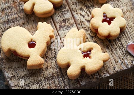 Animal shaped Linzer Easter cookies filled with red marmalade Stock Photo