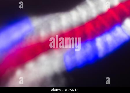 Vibrant abstract photo of red, blue and white blurred light lines with neon reflection and motion blur producing a dynamic, energetic composition idea Stock Photo