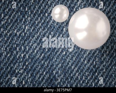 white pearls resting on blue denim fabric texture with copy space, rustic western style background for country wedding, cowgirl fashion, jewelry style Stock Photo