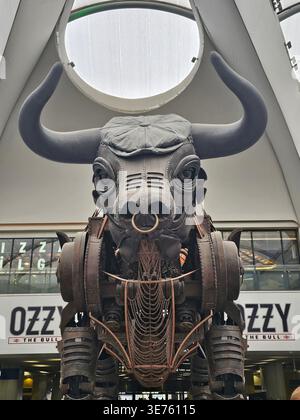 Ozzy the mechanical bull in a Peaky Blinders cap at Birmingham New Street Stock Photo
