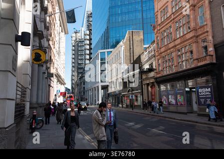 London street scene in financial district with modern building and workers Stock Photo