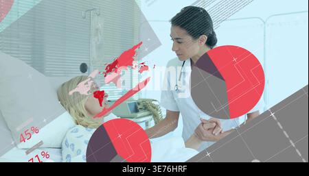Leaning clinician in white uniform checking woman wearing patterned gown at hospital bed, graphics Stock Photo