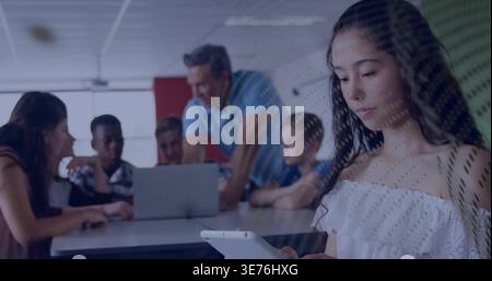 Tapping teen in white off-shoulder top using tablet at class right, long table, laptop, copy space Stock Photo