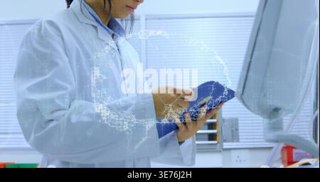 Writing on blue clipboard in clinical lab, tech wearing white lab coat with holographic globe Stock Photo