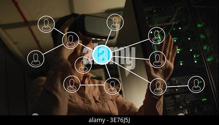 Interacting woman in light shirt with VR headset and headphones, using avatar network over servers Stock Photo