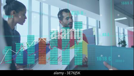 Reviewing colorful folders, man in red shirt and woman dark top in office with AR charts Stock Photo