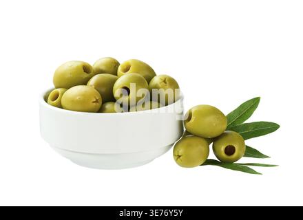 Pitted green olives in a white ceramic bowl isolated on a white background. marinated pitted olives. Pickled pitted green olives Stock Photo