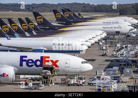 FedEx Express Boeing 777-FS2 cargo plane is unloaded, air freight
