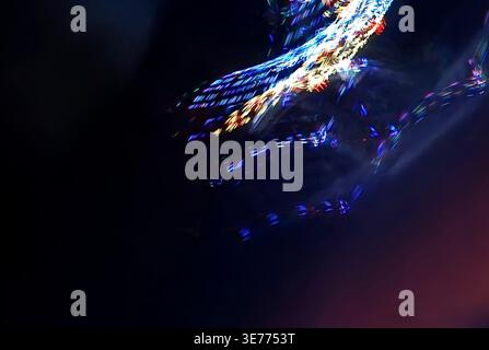 Abstract patterns from reflection of colored lights in motion. Stock Photo