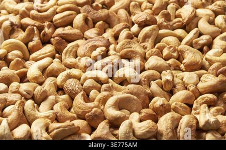 Roasted cashew nuts, texture and background. Tasty cashew nuts as background, cashew nuts texture. lay flat Stock Photo