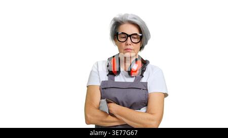 Senior serious woman worker wearing protective gear Stock Photo