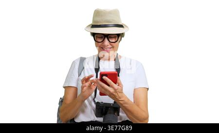 Woman traveler using smartphone for navigation on isolated background Stock Photo