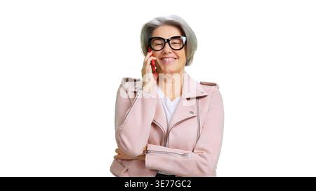 Happy senior woman talking on phone and smiling Stock Photo
