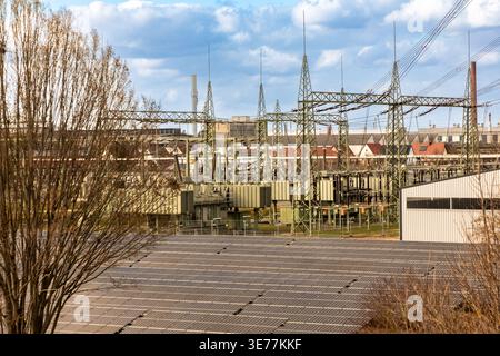 Solar park with substation at Lech river canal in Meitingen, Bavaria, Germany Stock Photo
