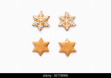 Blank and decorated gingerbread cookies isolated on white Stock Photo