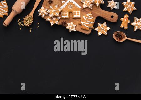 Christmas gingerbread cookies, spices on cutting board Stock Photo