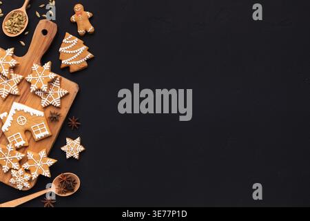 Christmas homemade gingerbread cookies, spices on cutting board Stock Photo