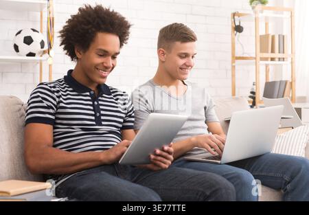 Young guys studying for exams at home Stock Photo