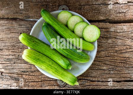 Fresh cucumber. fresh cucumber slices on wooden background, cucumber slices close up Stock Photo