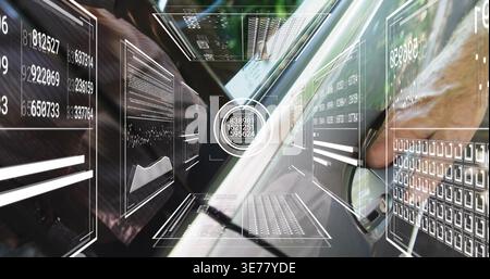 Mature analyst typing on laptop keys and wheel in cockpit, wearing business shirt, HUD reticle Stock Photo