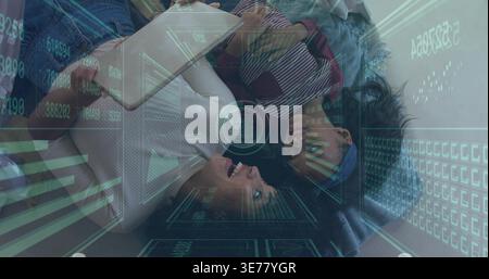 Lying mother and daughter holding tablet on couch in white ribbed top and striped shirt, HUD-style Stock Photo
