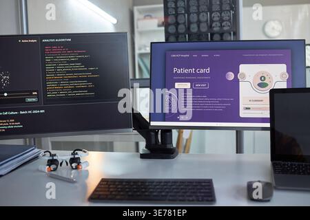 Close up of medical workstation displaying AI diagnostics code and digital patient card interface in clinic. Supporting healthcare software marketing, telemedicine, data analysis, innovation Stock Photo