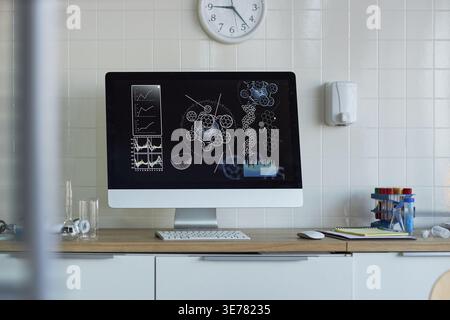 Wide shot of laboratory desktop computer displaying molecular analysis, charts, DNA structures for scientific research workflow. Useful for biotech marketing, medical innovation, data science Stock Photo