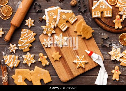 Decorating honey gingerbread Christmas cookies, top view Stock Photo