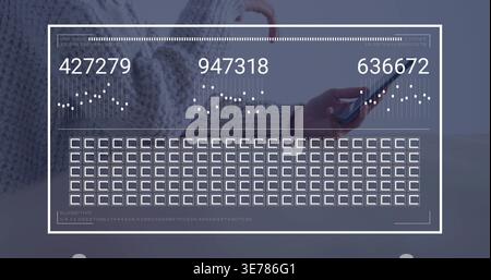 Tapping woman wearing chunky grey knit sweater checking smartphone at pale wood table, HUD overlay Stock Photo