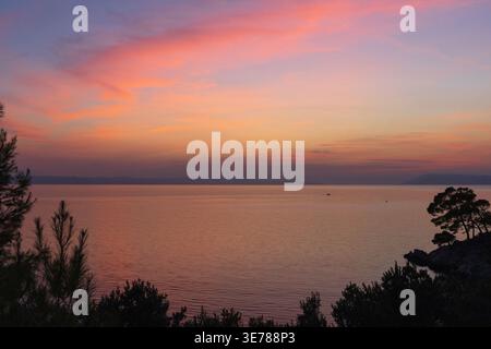 Colorful sunset sky over calm Adriatic sea Stock Photo