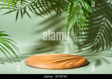 Wooden podium with leaves and shadows. Realistic wood platform for product presentation. Minimal nature scene with pedestal mockup. cosmetic display or award ceremony Stock Photo