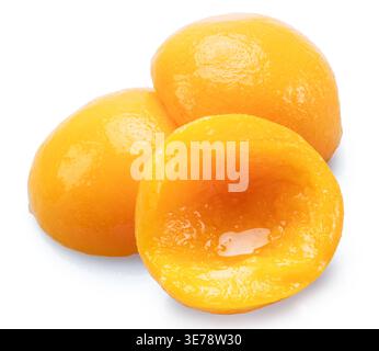 Peeled canned peach halves isolated on white background. File contains clipping paths. Stock Photo