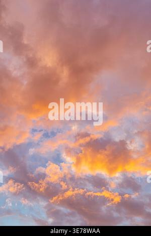 Sky with clouds in red - orange evening sunset. Stock Photo