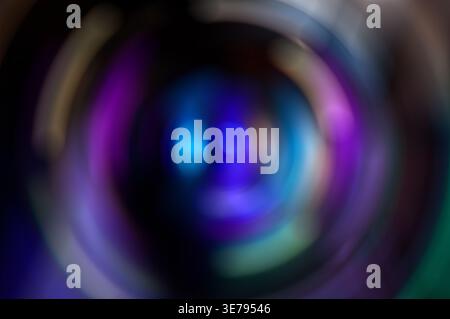 Abstract colorful lights blurring in circular motion creating a vibrant background Stock Photo