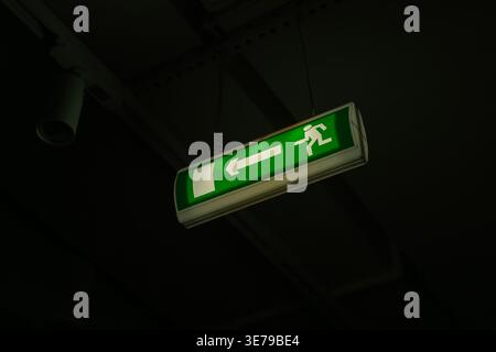 Exit sign on the ceiling Stock Photo