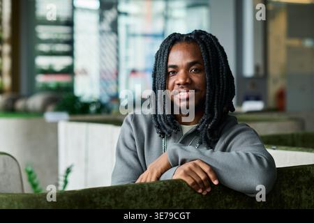 Portrait of Black Man Smiling in Modern Workplace for Branding Stock Photo