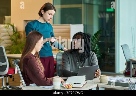 Diverse Business Team Discussing Project Strategy in Office Stock Photo