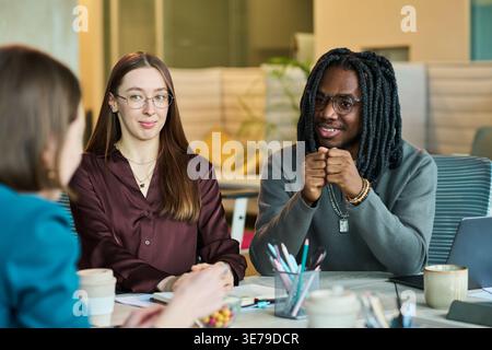 Diverse Business Team Collaborating in Office Meeting Stock Photo