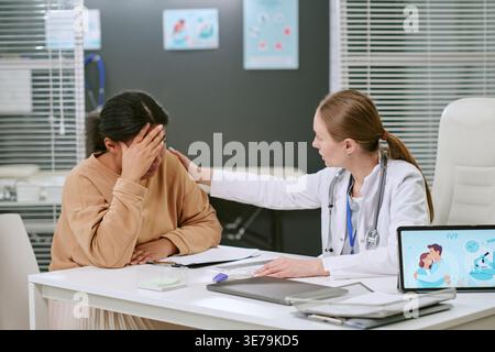 Adult Woman Receiving Emotional Support during Fertility Consultation Stock Photo