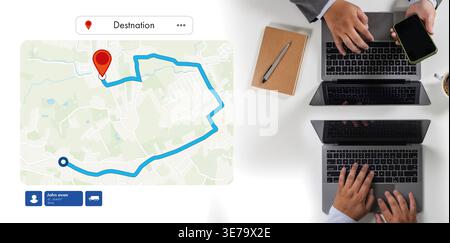 Warehouse manager analyzing logistics tracking dashboard on laptop showing delivery route and shipment data, supporting supply chain management, route Stock Photo