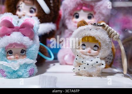 Lviv, Ukraine - April 08, 2026:  Pop Mart Dimoo collection plush keychain dolls in animal costumes Stock Photo