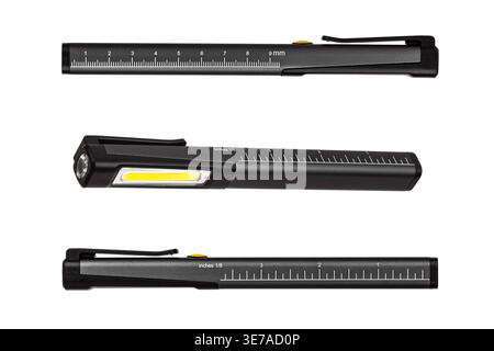 Three black pocket led flashlights with ruler scales isolated on white background. Stock Photo