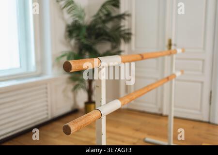Empty ballet dance studio with barre. Professional ballet barre for stretching practicing dancing positions in dance school Dance hall ready for ballet class training. Ballet school Stock Photo