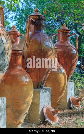View of the capasone, a clay container similar to a large yellow or yellow and brown jar, used in place of barrels especially in Apulia,Italy. Stock Photo
