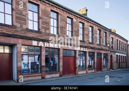 Annan old Market Hall building features classic architecture with sandstone construction and prominent signage Stock Photo