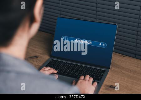 AI Search and Smart Information Discovery Concept. Woman using laptop with an AI search bar interface, representing intelligent search, fast Stock Photo
